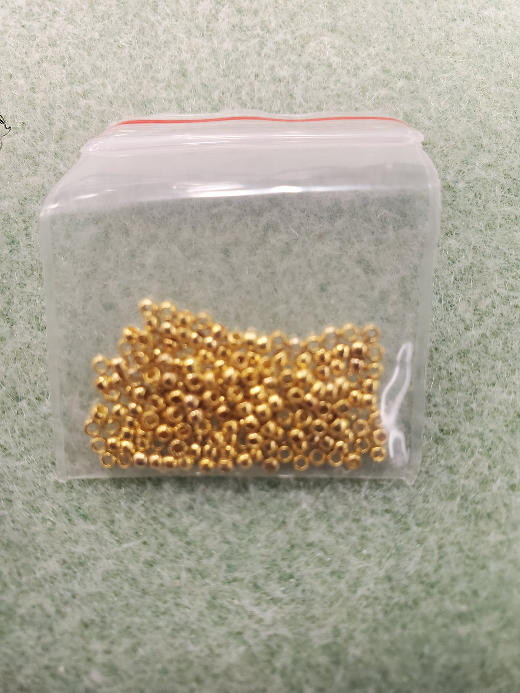 BRASS RONDELLE CRIMP BEAD