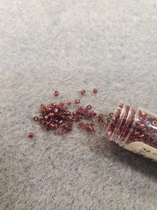 MIYUKI DELICA 11/0 DK CRANBERRY RED TR AB 1242