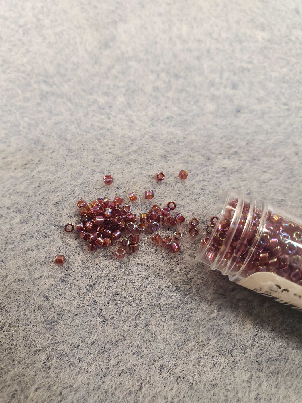 MIYUKI DELICA 11/0 DK CRANBERRY RED TR AB 1242
