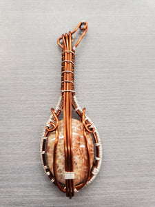 FOSSIL CORAL GUITAR PENDANT