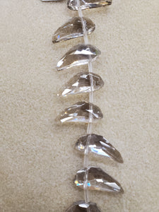 FACETED GLASS MAGATAMA 22X19X10.5MM