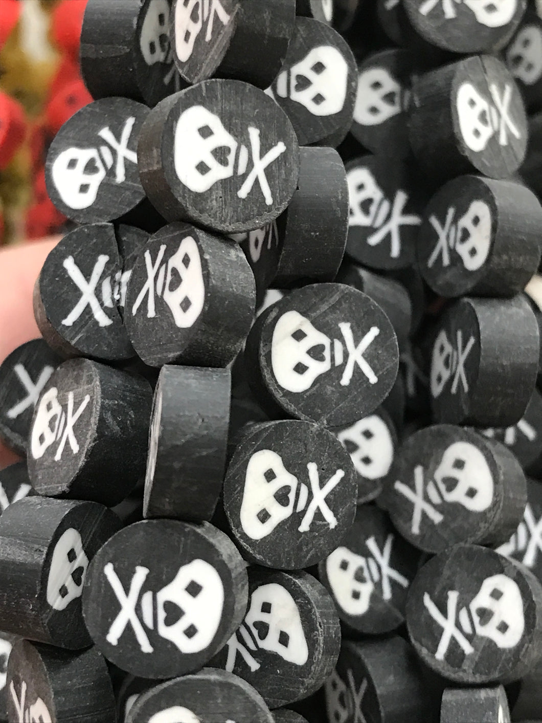 CLAY BEADS 9X4MM SKULL