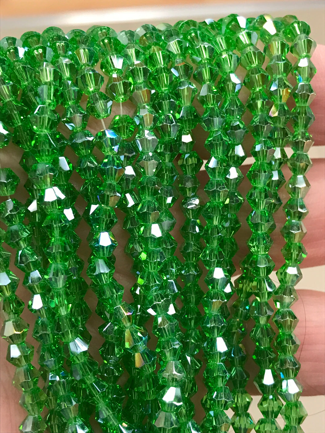 GLASS BICONE FACETED 4MM