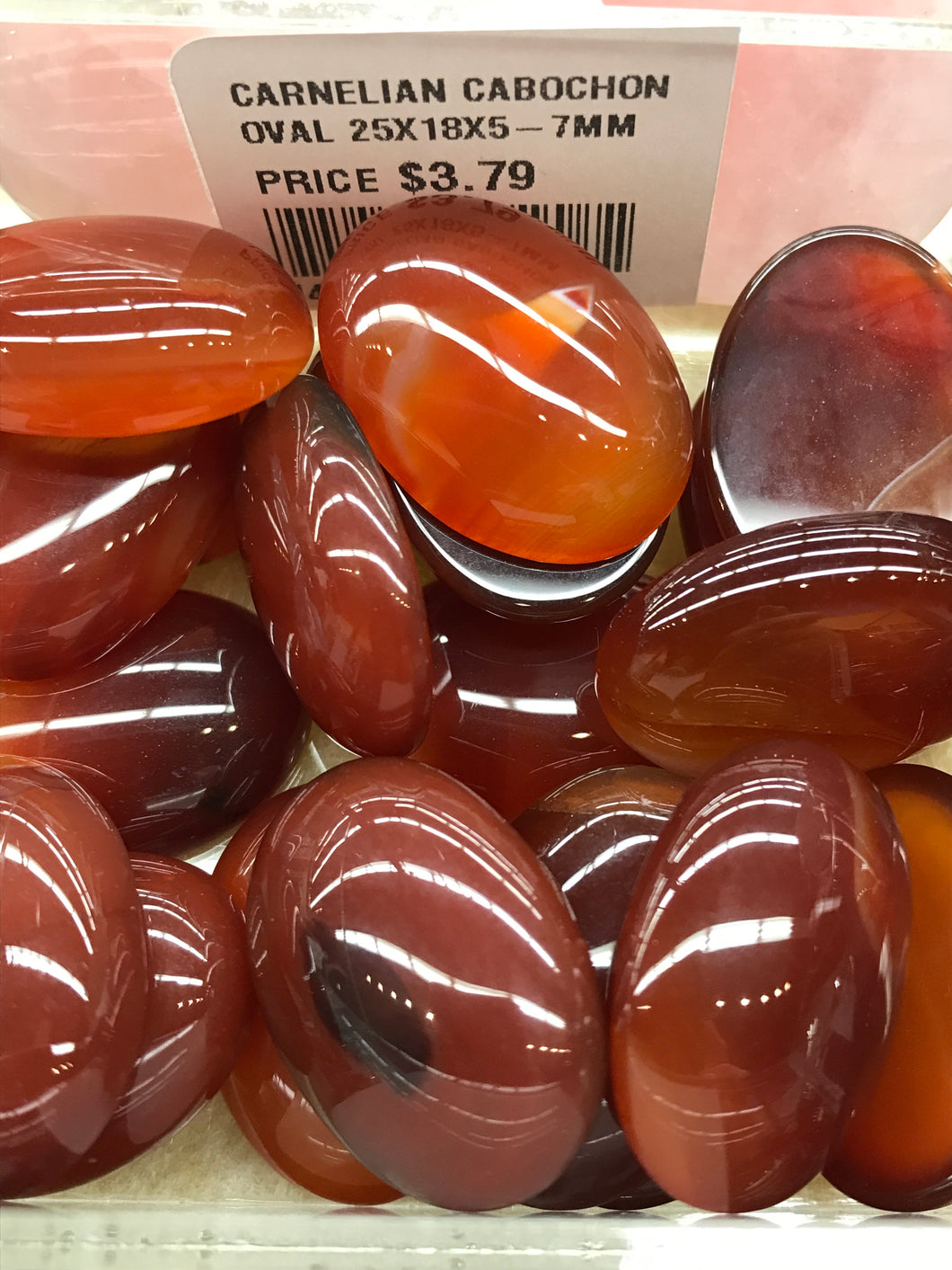 CARNELIAN CABOCHON OVAL 25X18X5-7MM