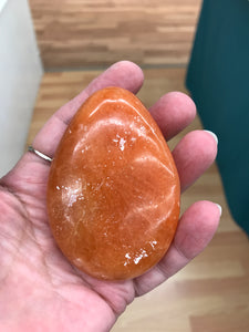 ORANGE TWIST CALCITE PALM STONE