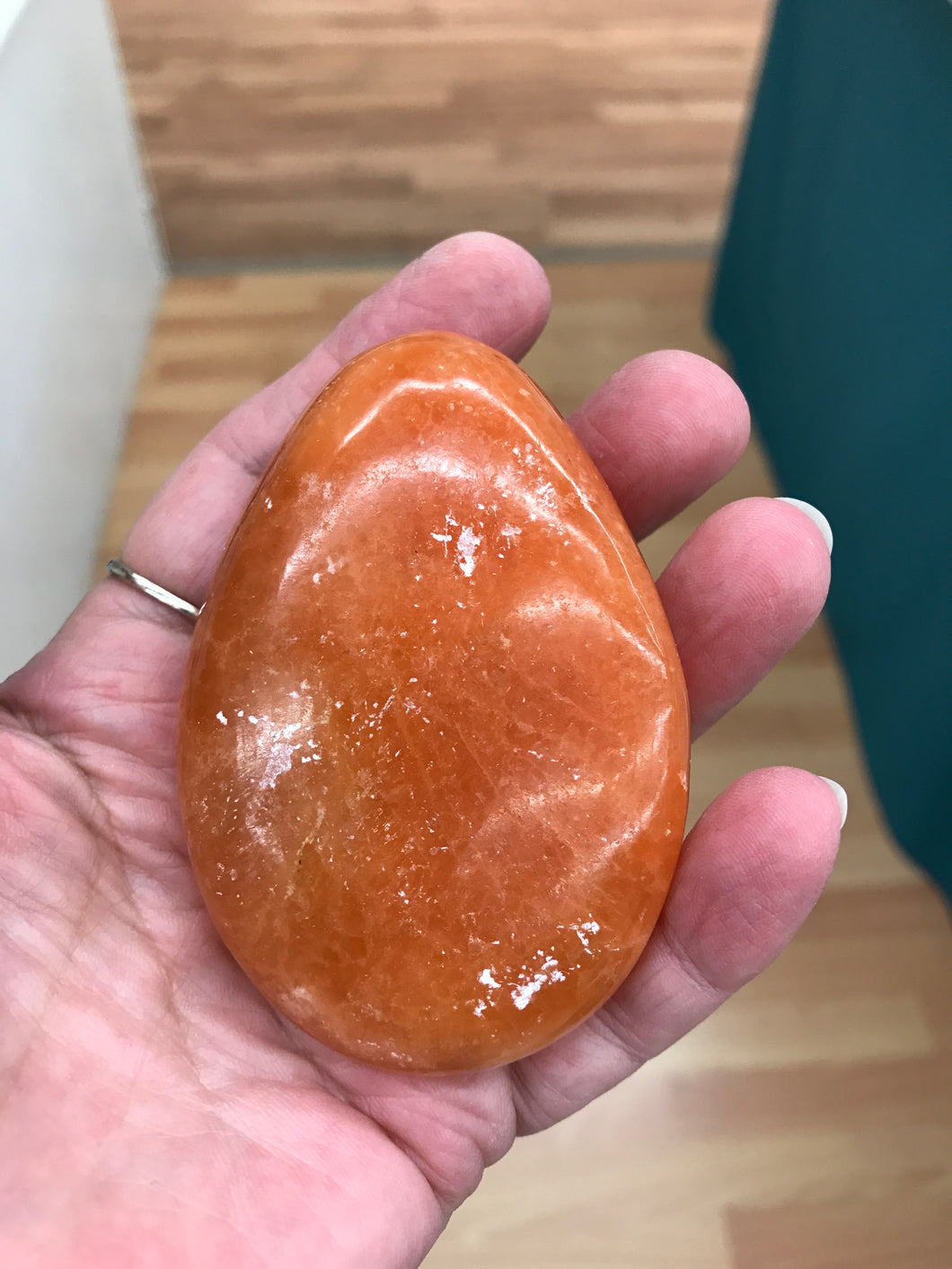ORANGE TWIST CALCITE PALM STONE