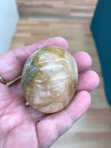ORANGE TWIST CALCITE PALM STONE