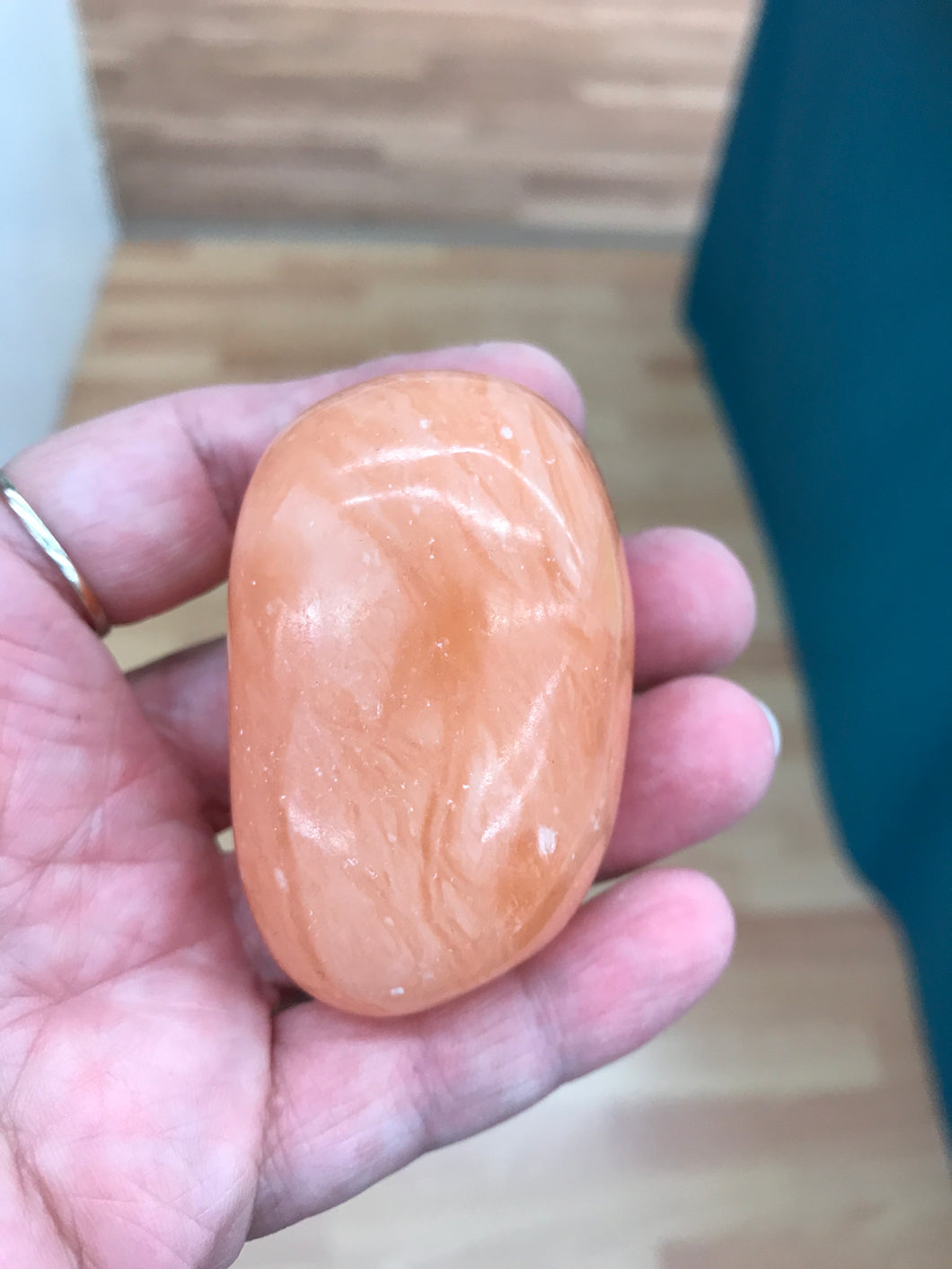ORANGE TWIST CALCITE PALM STONE